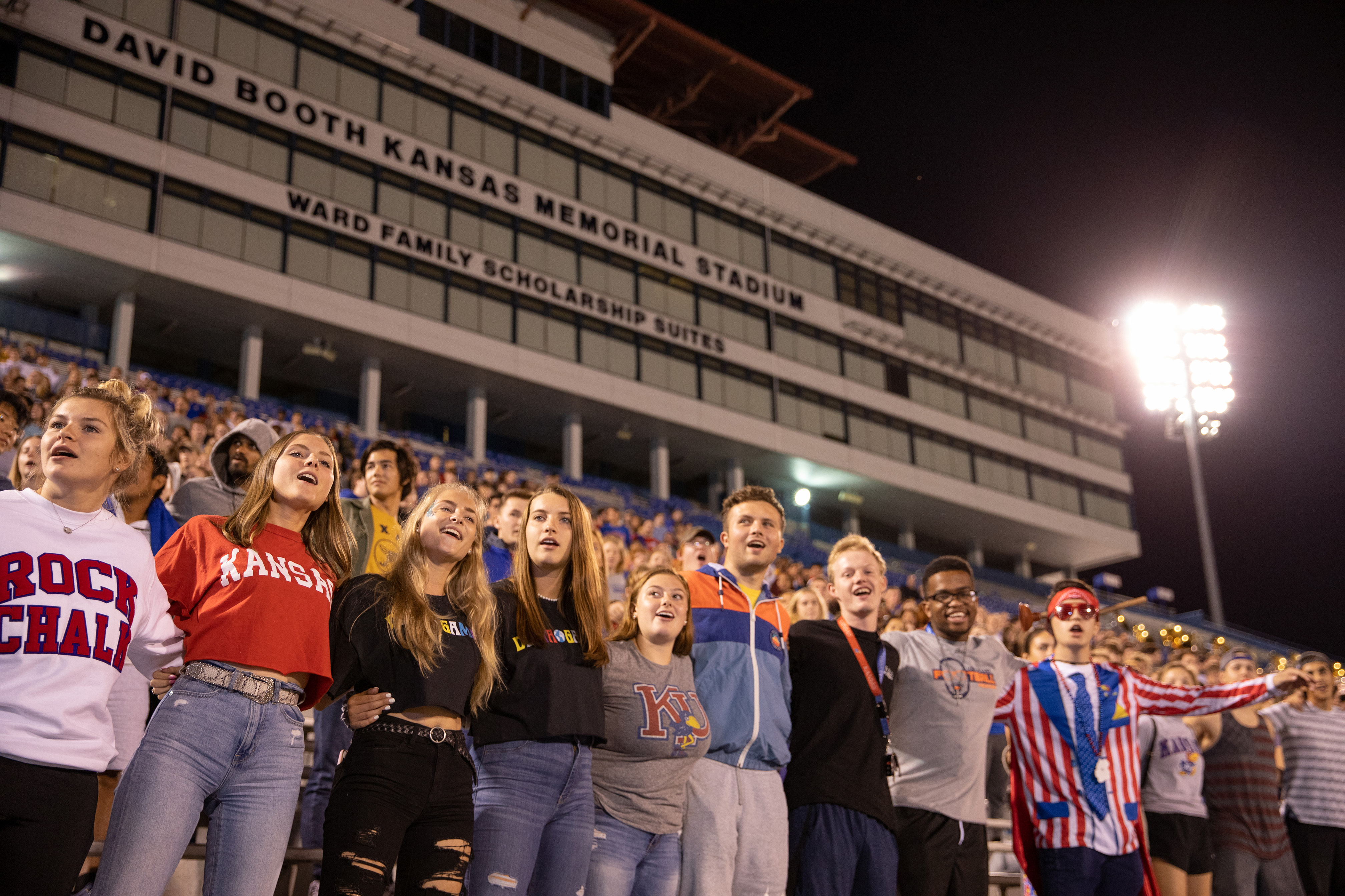 Students sing arm-in-arm at Traditions Night.